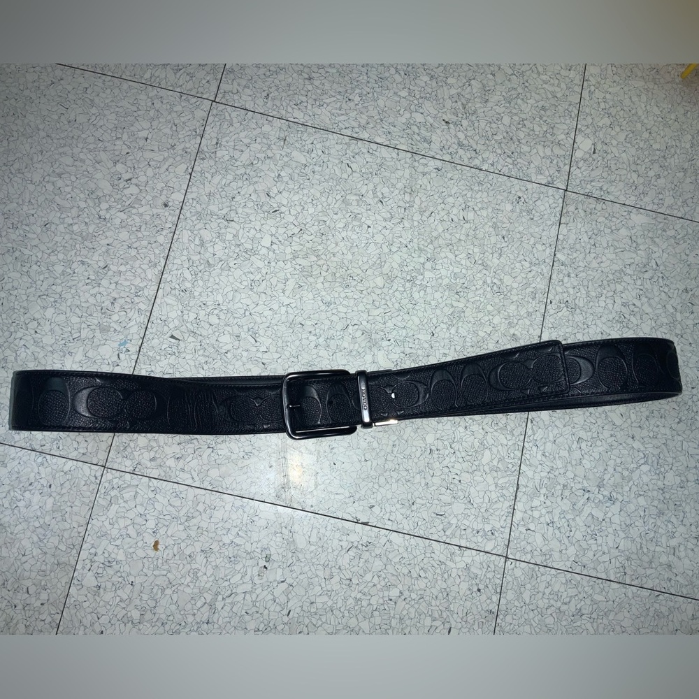 Coach belt mens Sz. 42. Belt has an extra hole made to fit as pictured.